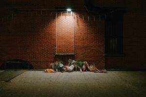 Floral memorial on the sidewalk on Thompkins at Myrtle