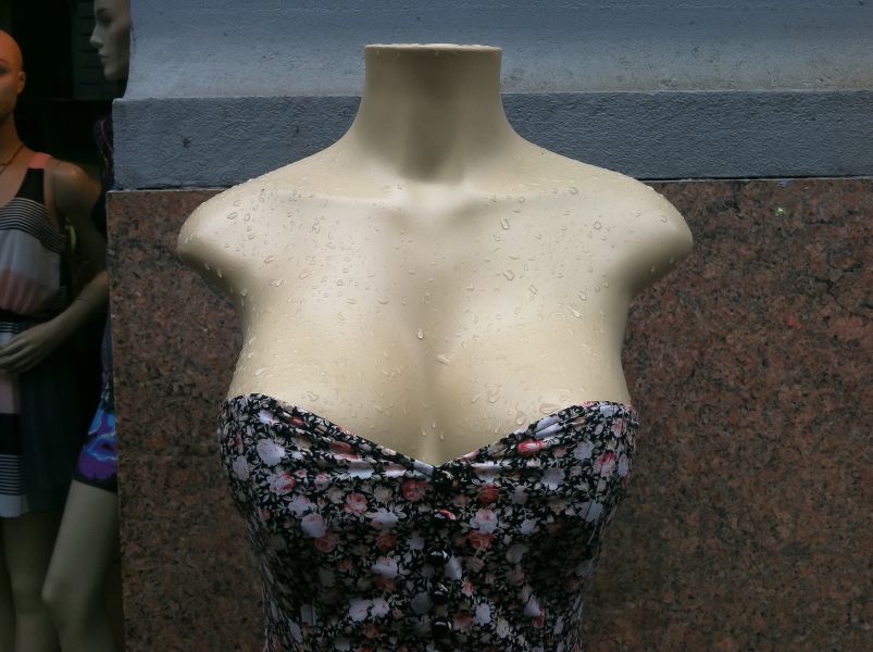hot wet plastic breasts with a dress on a mannequin