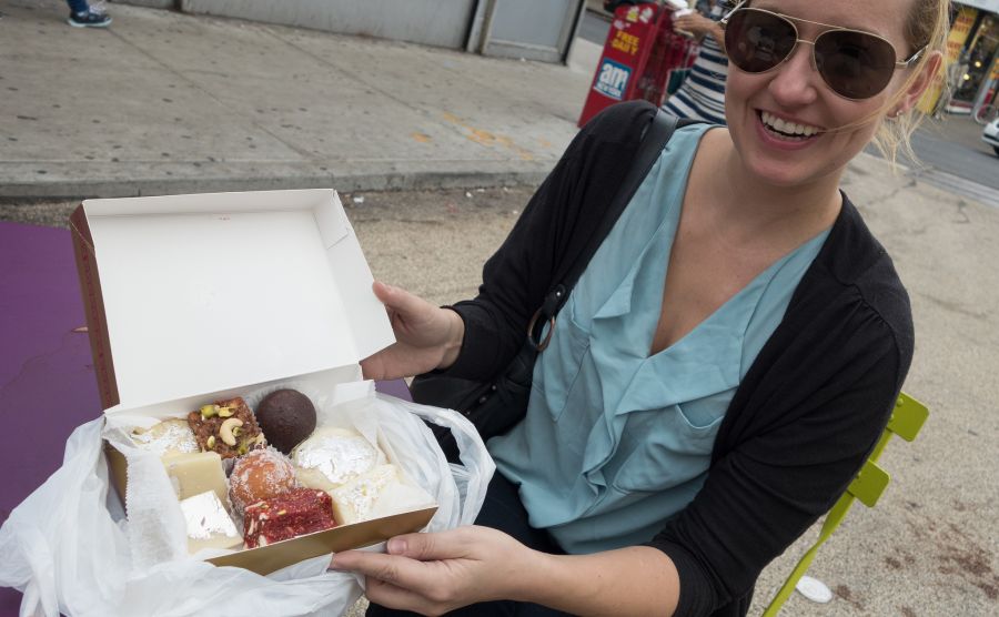 blond woman box of maharaja sweets