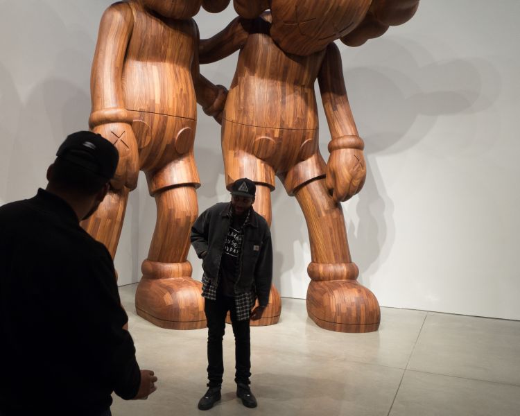 Posing in front of KAWS at Mary Boone
