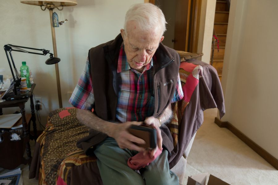 Pap sorting a stack of wallets