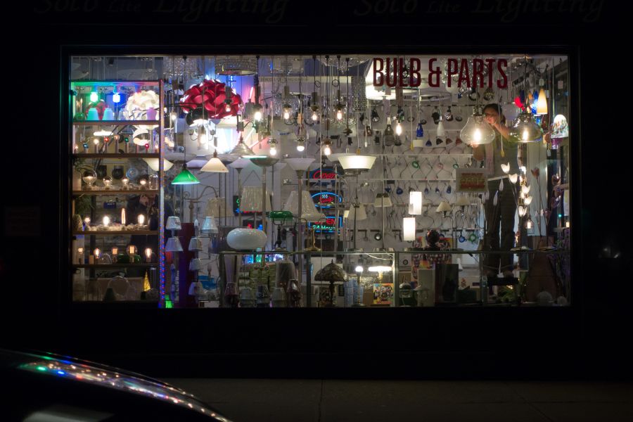 Woman working in a lighting store.