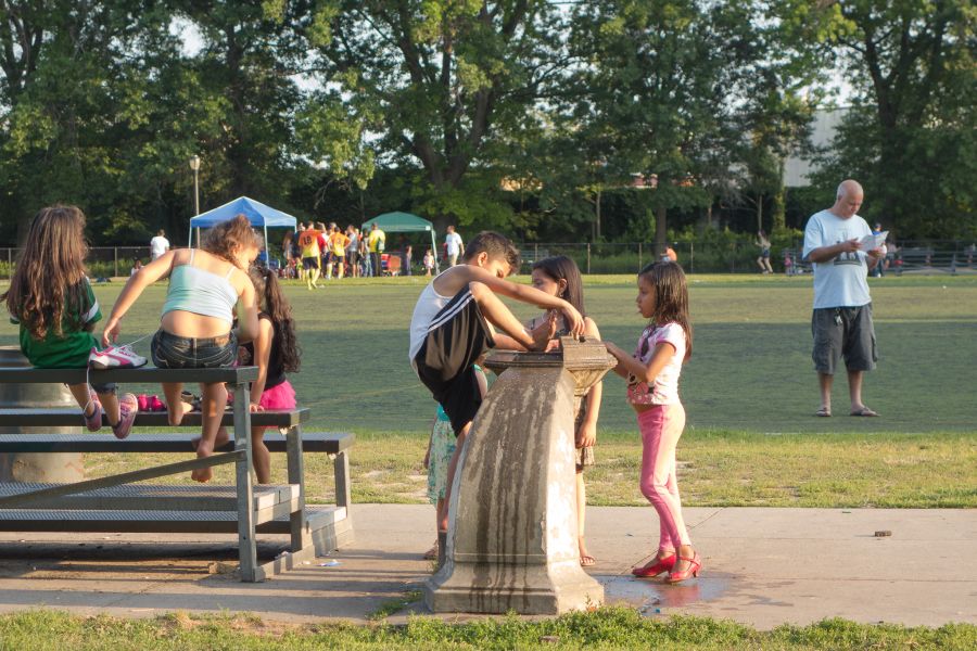 children feet in water fountain