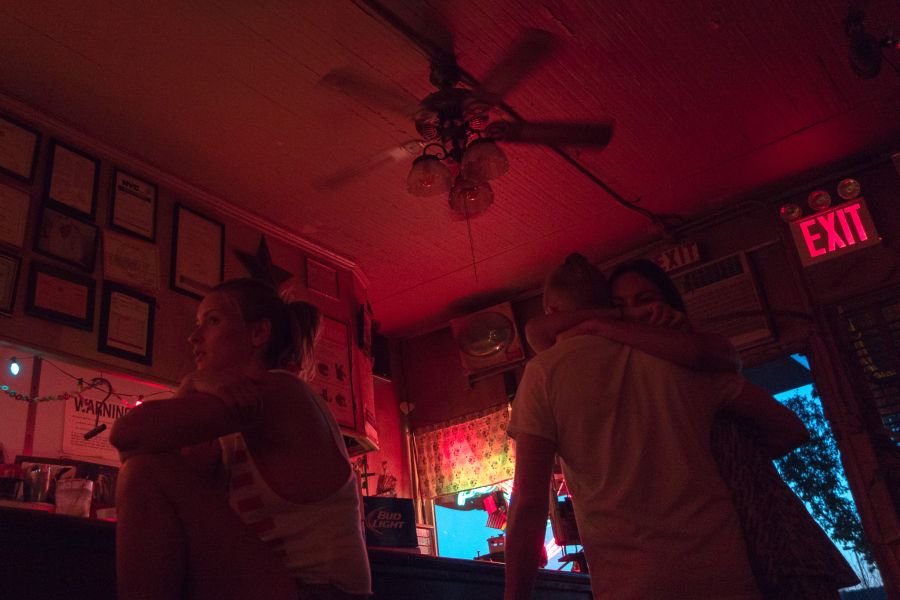 couple embracing in bar entryway