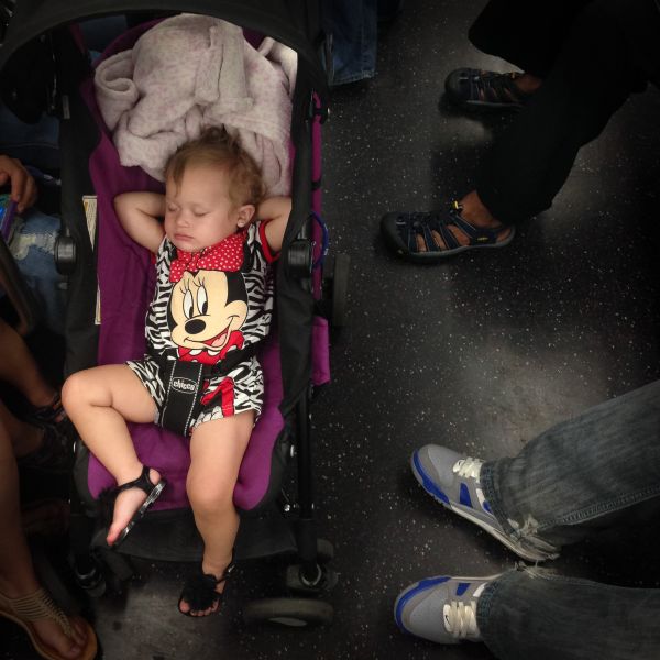 A toddler reclines in a stroller