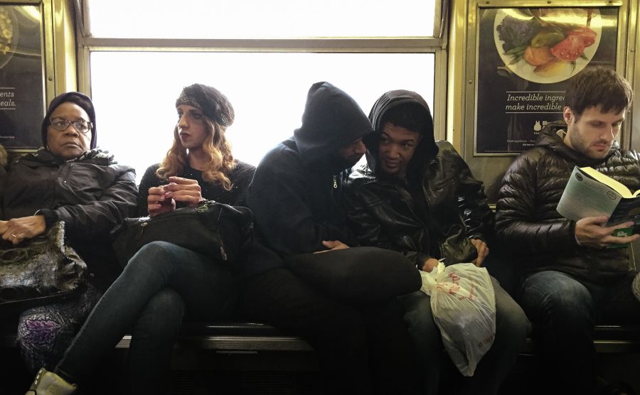Commuters sharing secrets on J Train in Brooklyn Bed-Stuy